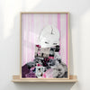 Framed collage art with a stylized face on a pink and white striped background